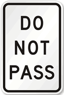 Do Not Pass Sign road sign — White rectangular sign with black text DO NOT PASS